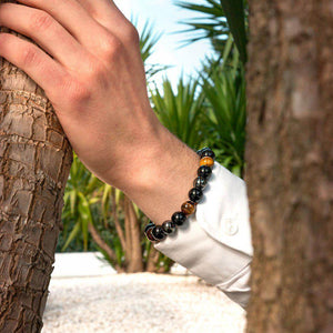 Pulseira Tríplice Guardiã, Obsidiana, Olho de Tigre, Hematita, Pedras Naturais, Proteção Energética, Clareza Mental, Equilíbrio Emocional, Energia Positiva, Litoterapia, Acessório de Proteção, Magia Negra, Estabilidade Mental, Fortalecimento, Vitalidade, Jóia de Energia, Terapia com Pedras, Pulseira Ajustável, Amuleto de Proteção, Energia Natural.