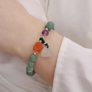 Pulseira Encanto de Jade, Pedras Naturais, Amuleto de Boa Sorte, Energia Positiva, Purificação, Jade Verde, Ametista, Calcedônia, Jade Laranja, Meditação, Proteção Energética, Moda e Espiritualidade, Elegância Natural, Jóia Encantadora, Significado das Pedras, Equilíbrio Interior, Bem-estar, Atração de Prosperidade, Presente Significativo, Moda Conscienta