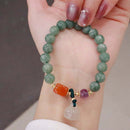 Pulseira Encanto de Jade, Pedras Naturais, Amuleto de Boa Sorte, Energia Positiva, Purificação, Jade Verde, Ametista, Calcedônia, Jade Laranja, Meditação, Proteção Energética, Moda e Espiritualidade, Elegância Natural, Jóia Encantadora, Significado das Pedras, Equilíbrio Interior, Bem-estar, Atração de Prosperidade, Presente Significativo, Moda Consciente