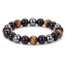 Pulseira Tríplice Guardiã, Obsidiana, Olho de Tigre, Hematita, Pedras Naturais, Proteção Energética, Clareza Mental, Equilíbrio Emocional, Energia Positiva, Litoterapia, Acessório de Proteção, Magia Negra, Estabilidade Mental, Fortalecimento, Vitalidade, Jóia de Energia, Terapia com Pedras, Pulseira Ajustável, Amuleto de Proteção, Energia Natural.