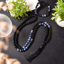 Japamala, Pulseira de Ônix, Lápis Lazuli, Espiritualidade, Estabilidade, Sabedoria, Meditação, Conexão Espiritual, Energias Positivas, Mala de Oração, Contas Naturais, Acessório Espiritual, Equilíbrio Energético, Proteção Energética, Ferramenta de Meditação, Japamala Artesanal, Cristais Naturais, Elevação Espiritual, Presente Espiritual, Acessório Terapêutico